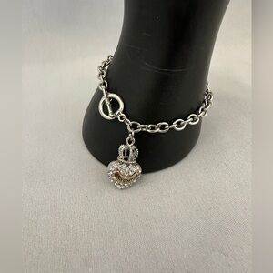 Juicy Couture silver tone toggle chain bracelet with rhinestone heart charm